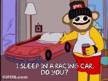 A Cartoon Character With A Beanie That Says Pups Is Standing In Front Of A Racing Car Bed GIF