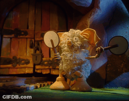A Cartoon Character With A Beard Is Holding A Mirror And An Axe GIF