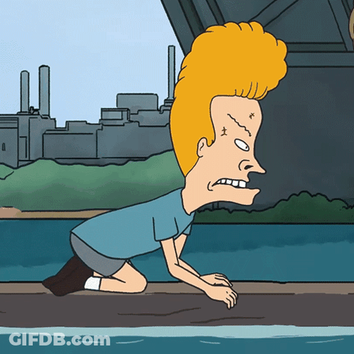 A Cartoon Character With A Big Head Is Kneeling Down GIF