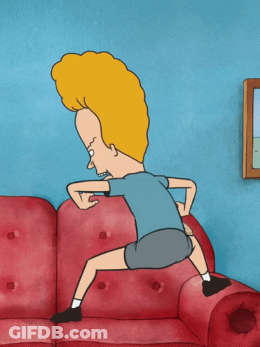 A Cartoon Character With A Big Head Is Squatting Down On A Red Couch GIF