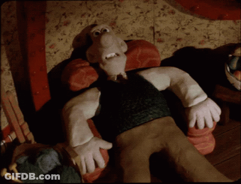 A Cartoon Character With A Big Nose Is Laying On A Couch GIF