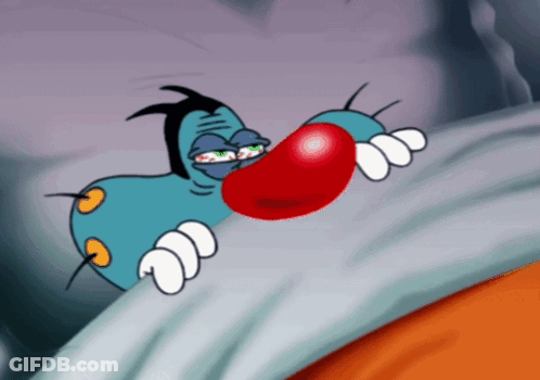 A Cartoon Character With A Big Red Nose Is Laying In Bed GIF