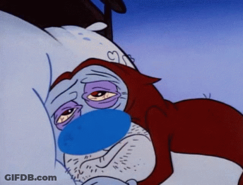 A Cartoon Character With A Blue Nose Is Laying In Bed With His Eyes Closed GIF
