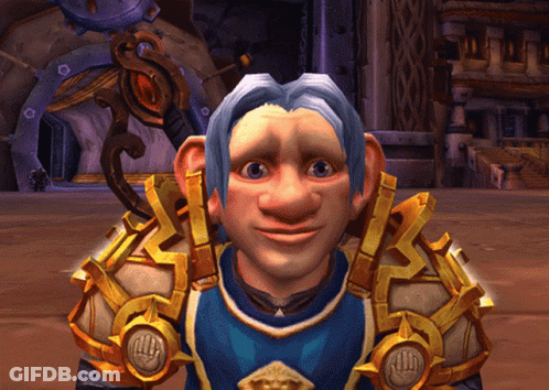 A Cartoon Character With A Blue Shirt And Gold Armor Looks At The Camera GIF