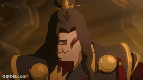 A Cartoon Character With A Crown On His Head Is Covering His Face With His Hand GIF