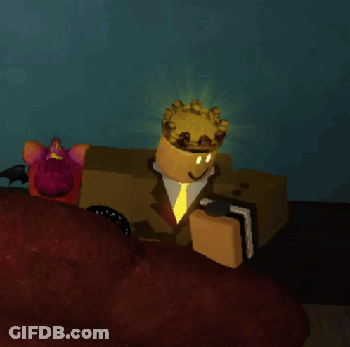A Cartoon Character With A Crown On His Head Is Sitting On A Couch GIF