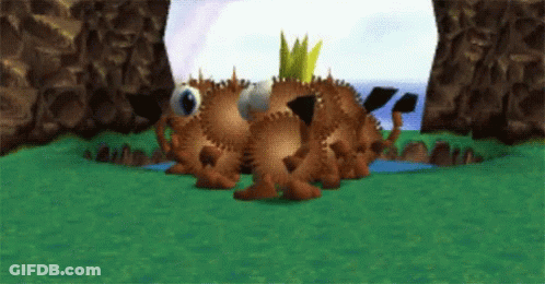 A Cartoon Character With A Crown On Its Head Is Laying In The Grass GIF