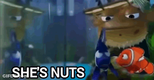 A Cartoon Character With A Fish And The Words She 'S Nuts Behind Him . GIF