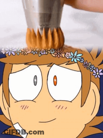 A Cartoon Character With A Flower Crown On His Head Is Being Decorated With Frosting . GIF