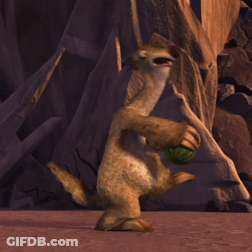 A Cartoon Character With A Green Ball In Its Mouth GIF