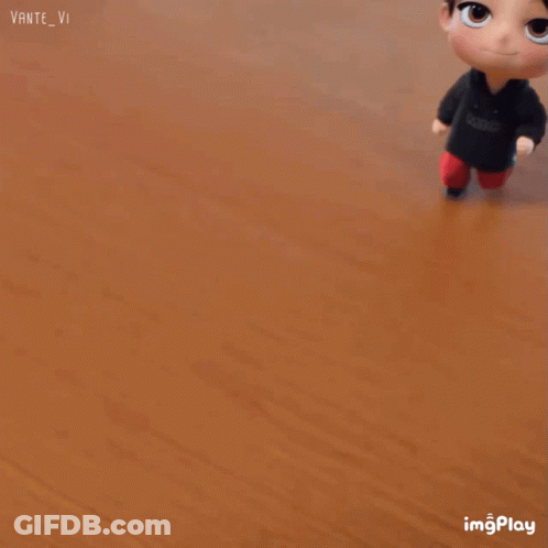 A Cartoon Character With A Headband On His Head Is Standing On A Wooden Floor .. GIF