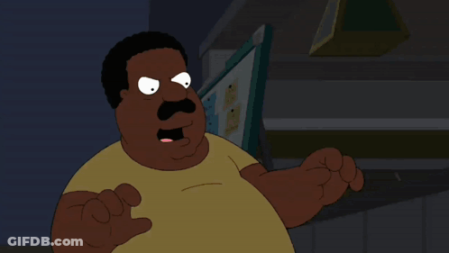A Cartoon Character With A Mustache And A Yellow Shirt Stands In Front Of A Computer Monitor GIF