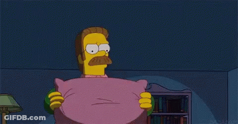 A Cartoon Character With A Mustache Is Holding A Pink Pillow . GIF