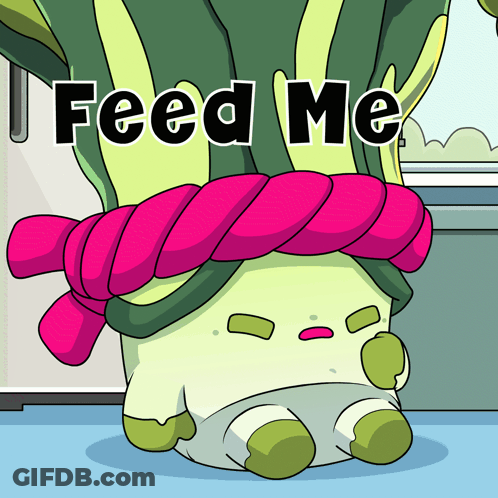 A Cartoon Character With A Pink Scarf Around Its Neck That Says Feed Me GIF