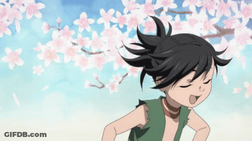 A Cartoon Character With A Ponytail Is Standing In Front Of A Tree With Pink Flowers GIF