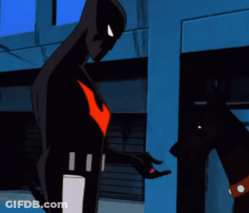 A Cartoon Character With A Red Arrow On His Chest Is Standing In Front Of A Building GIF