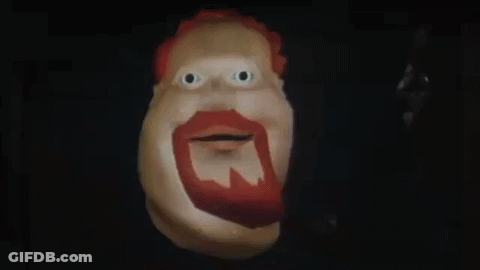 A Cartoon Character With A Red Beard Is Smiling And Says Hiya Slugger In The Dark . GIF