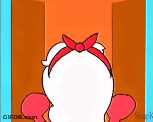 A Cartoon Character With A Red Bow On Her Head Is Standing In An Open Doorway . GIF