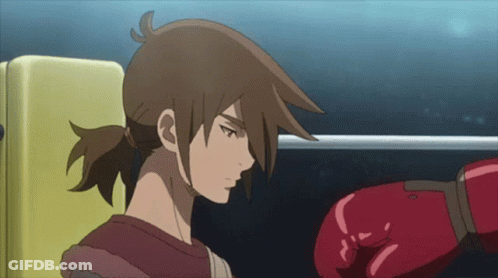A Cartoon Character With A Red Boxing Glove On His Hand GIF