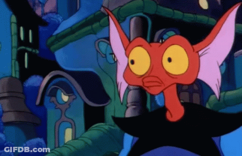 A Cartoon Character With A Red Head And Yellow Eyes Stands In Front Of A Building GIF