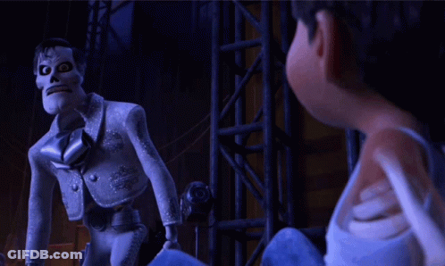 A Cartoon Character With A Skull On His Head Is Standing Next To Another Cartoon Character GIF