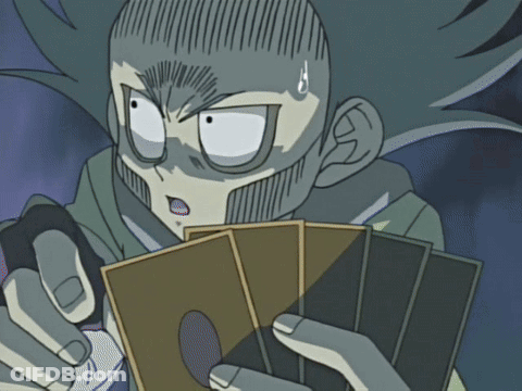 A Cartoon Character With A Surprised Look On His Face Holding A Deck Of Cards GIF
