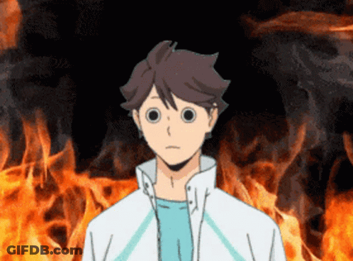 A Cartoon Character With Big Eyes Stands In Front Of A Fire GIF
