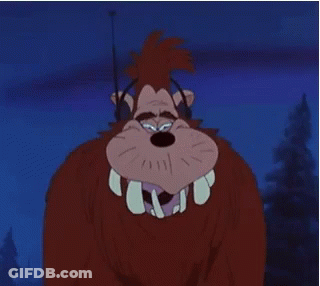 A Cartoon Character With Big Teeth And Headphones On GIF