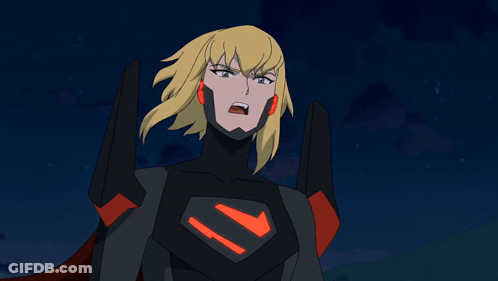 A Cartoon Character With Blonde Hair And A Red Cape Is Pointing Her Fist At The Camera GIF