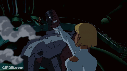 A Cartoon Character With Blonde Hair And Blue Eyes Is Wearing A White Suit GIF