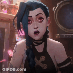 A Cartoon Character With Blue Hair And A Tattoo On Her Arm Is Looking At The Camera . GIF