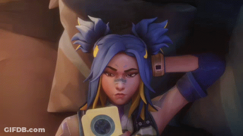 A Cartoon Character With Blue Hair Is Holding A Piece Of Paper With A Circle On It GIF