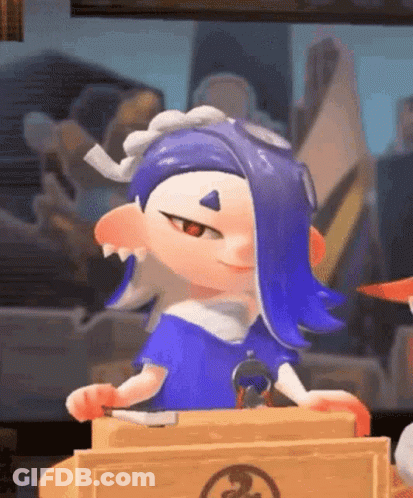 A Cartoon Character With Blue Hair Is Sitting At A Table Holding A Knife And Smiling . GIF