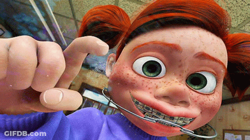 A Cartoon Character With Braces On Her Teeth Is Pointing GIF