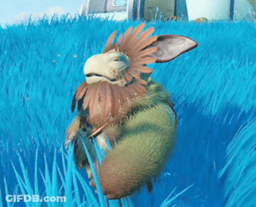 A Cartoon Character With Feathers On Its Head Is Laying In The Grass GIF