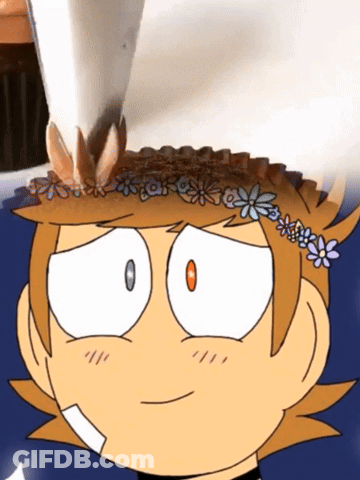 A Cartoon Character With Flowers On His Head GIF