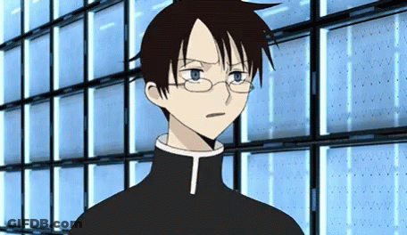 A Cartoon Character With Glasses And A T On His Chest GIF