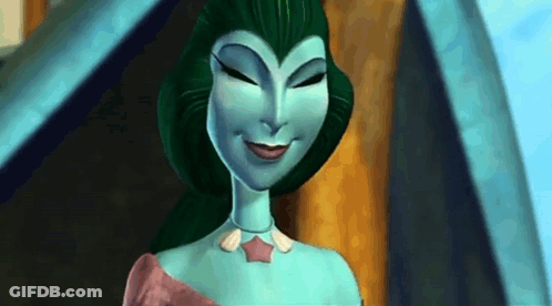 A Cartoon Character With Green Hair And A Blue Body Is Smiling . GIF