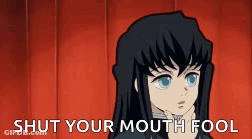 A Cartoon Character With Long Black Hair Is Holding His Hand To His Chin And Saying `` Shut Your Mouth Fool '' . GIF