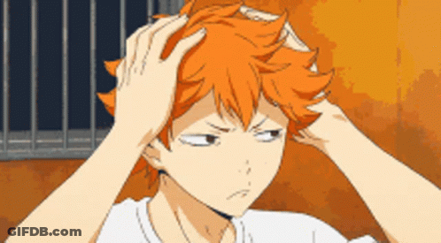 A Cartoon Character With Orange Hair Is Holding His Head GIF