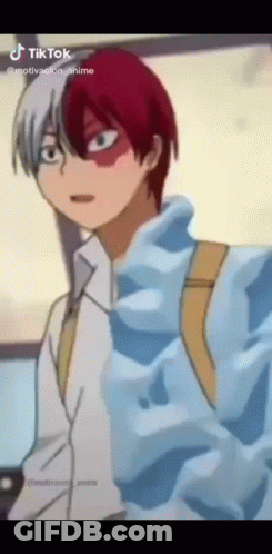 A Cartoon Character With Red And White Hair Is Wearing A Blue Jacket . GIF