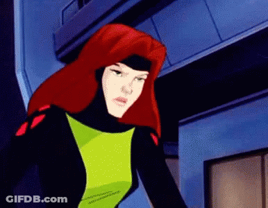 A Cartoon Character With Red Hair And A Green Top GIF