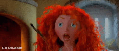 A Cartoon Character With Red Hair And Blue Eyes GIF