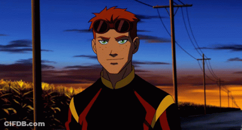 A Cartoon Character With Red Hair And Goggles Stands In Front Of A Sunset GIF