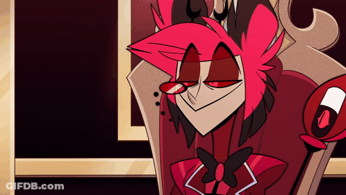 A Cartoon Character With Red Hair And Red Eyes Is Sitting In A Chair GIF