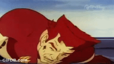 A Cartoon Character With Red Hair Is Laying On The Ground With His Eyes Closed . GIF