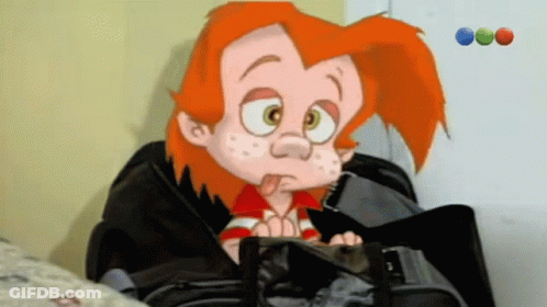 A Cartoon Character With Red Hair Is Sitting In A Black Suitcase GIF