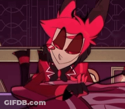 A Cartoon Character With Red Hair Is Sitting On A Bed And Smiling . GIF