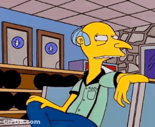 A Cartoon Character With The Name Minty On His Shirt Is Sitting In Front Of A Bowling Alley GIF