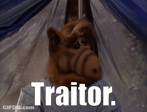 A Cartoon Character With The Word Traitor On The Bottom GIF